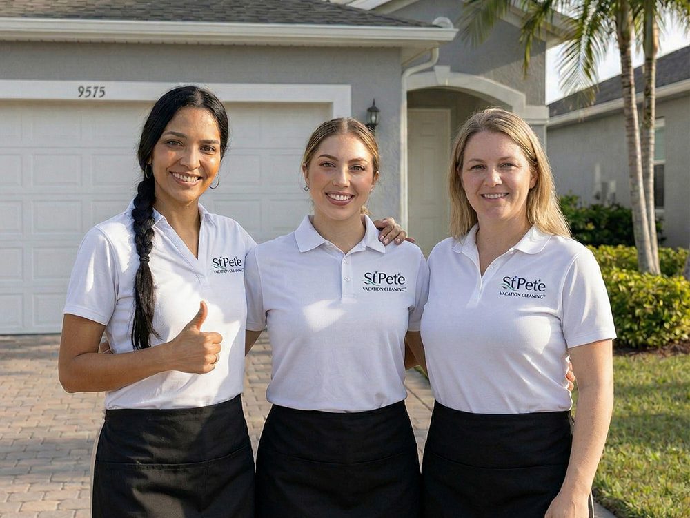 St. Pete Vacation Cleaning team members standing in front of a vacation rental home in St. Pete Beach, Florida.